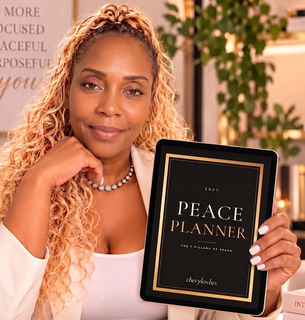 Cheryl, a dual board-certified nurse and founder of Cheryl On Lux, holding the 2027 Peace Planner on a tablet.